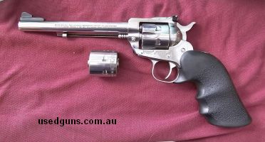 Ruger Single Six (stainless) with 6.5" barrel. Overall good to very good condition with minor wearing. Functions flawlessly. Comes with 22/22 mag cyliners, and 
