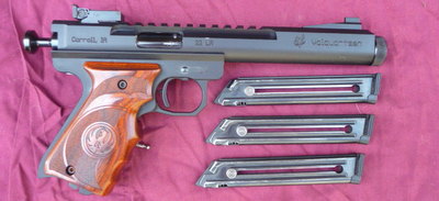 Comes with 2 magazines. And a volquartsen orthapedic grip right handed.