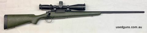 The ultra magnum! This premium custom shop long range rifle is one of the finest examples of the breed. Fully cerakoted stainless action and barrel, fluted for 