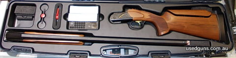Gun comes with choke and is in hard case.