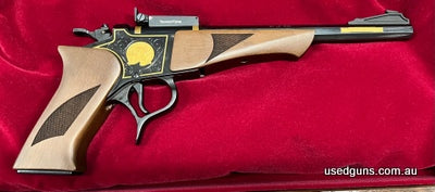Thompson Centre G2 Contender 50th Anniversary 22LR. Blued 10 inch octagonal barrel with Gold inlay. Gold 50th Anniversary logo on one side of action and gold bo