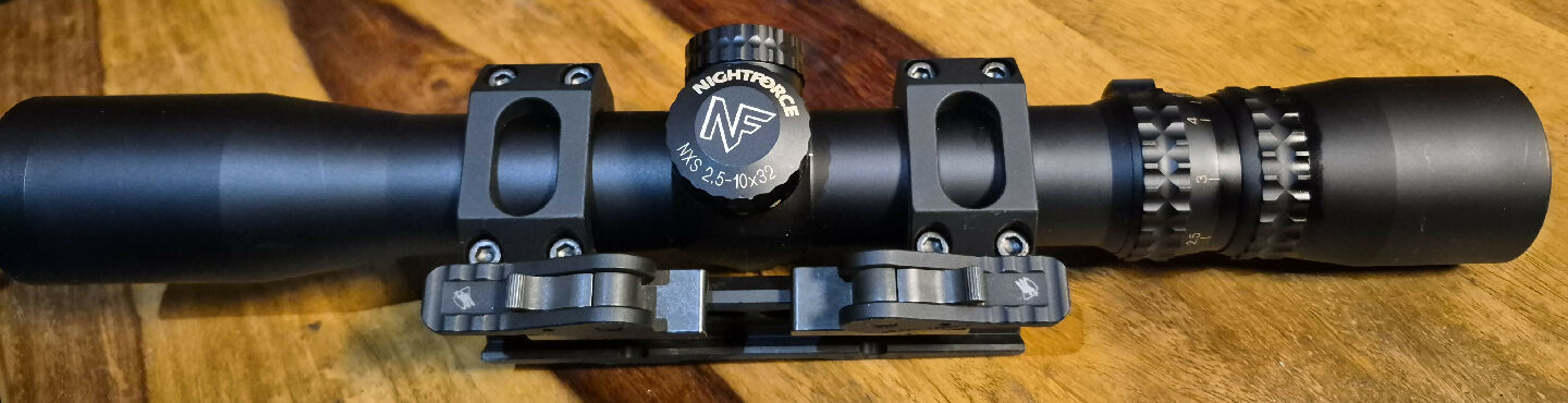 Nightforce NXS 2.5-10X32. In an American Defense Manufacturing QD mount. Excellent condition. Works perfectly. Reluctant SALE. Made in USA. Plus post.