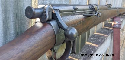 Magazine lee enfield in fair but shootable condition, missing one of the rear sight screws and front sight is shimmed with some copper wire. comes with reproduc