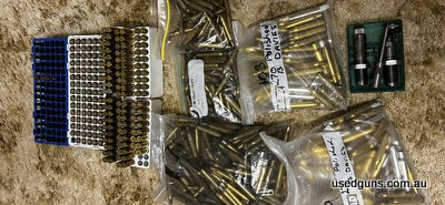 270W brass and reloading dies and length sizer approx 500 rounds make us an offer.