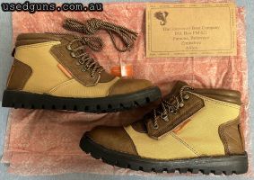 A new-in-box pair of Courteney Boot Company Safari Boots, handmade in Bulawayo, Zimbabwe. These boots are of canvas and buffalo hide construction, and were made