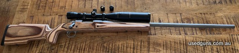 Stainless Remington 700 SA 223 converted to single shot, 28" Krieger barrel, Timney trigger, pillar bedded into Boyds laminated Pro Varmint stock, Weaver rail, 