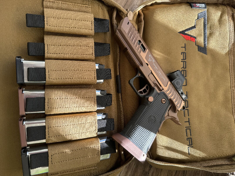 TTI SAND VIPER 9mm in perfect condition basically new due to only max 200 rounds shoot.Comes with TTI carry bag and original  TTI 4x mags and Trijicon red dot.
