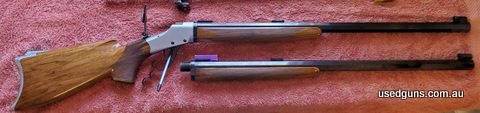 Custom switch barrel takedown Falling Block Works Rifle with twin 27 inch octagonal barrels in 38-55 and 32-40. Both barrels with beautifully checked stocks Pop