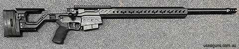 As new Accuracy International At-X in 6.5 Creedmoor. Only fired 40 rounds. Has 26" Proof Research barrel with brake. Includes optional top section of fore-end. 