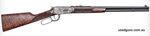 Winchester model 1894 Deluxe in 30-30. 8 shot 24 inch half round half octagonal barrel. Chequered grade 3 Walnut stock and forend. Deep gloss blued finish, colo