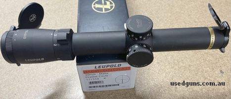 Near new condition, has very faint ring marks. 30mm tube, matte black, FireDot circle reticle. Custom dial system. Scope caps. Includes 30mm Leupold rings and b