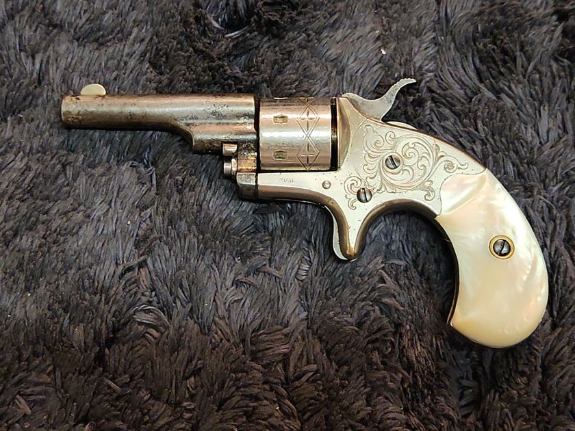 Engraved Colt Opentop Pocket revolver