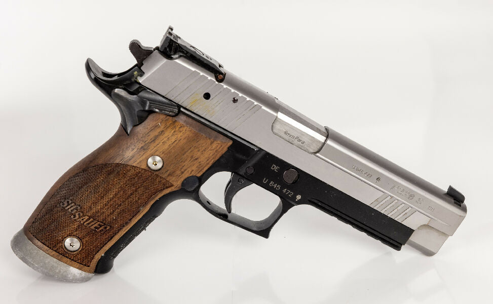 SAO Sig Sauer P226 X-Five AL with 2 magazines. Overall it is in good condition, but I am listing it as fair as some of the parkerization is coming off.