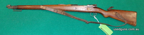 Missing rear sight, has had 4 holes drilled in left side of stock