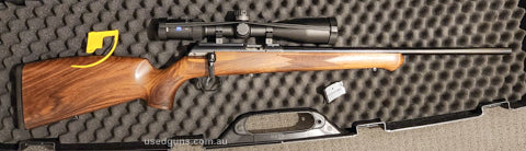 Fortner Straight-pull action 22" match grade barrel. Anschutz 5020 two-stage, adjustable weight and pull length match trigger. Gloss blue. Walnut German Hog sty