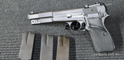 1981 Browning Hi Power Competition with factory longer barrel, Pachmayr wrap around grip and 50 Gram counterweight to reduce muzzle lift. Pistol in Fair conditi