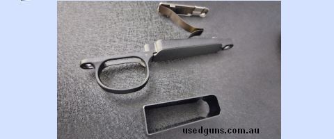 Like new standard remington 700 bottom metal in black. Can post Aus wide