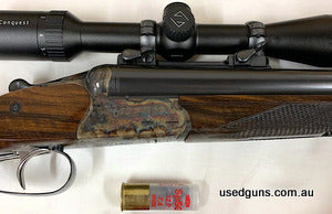 Perfect condition and extremely rare, left hand Merkel Drilling. Manufactured December 1982. 12G x 12G x 222 Remington. Exceptional colour case hardening to the