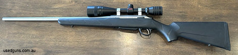T3 Stainless Synthetic Stock with 6-18x44 Redfield Revenge. Had less than 25 rounds through it. Some tiny spots on right hand side of barrel.