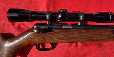 Made in Belgium Browning T- bolt 22LR. In good condition with steel mounts and early model Leupold 4X. Accurate and fast straight pull action and all steel cons