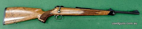 Mauser M03 Alpine with stunning grade 6 stock showing extensive tiger stripe and dark contrasting grain. I have this rifle listed for sale in both 300 Wby Mag a