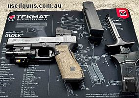 This Glock 34 Gen 5 comes with a red dot Venom sight, full cleaning kit, Olight underslung green laser dot and flashlight. A full trigger works have been done a
