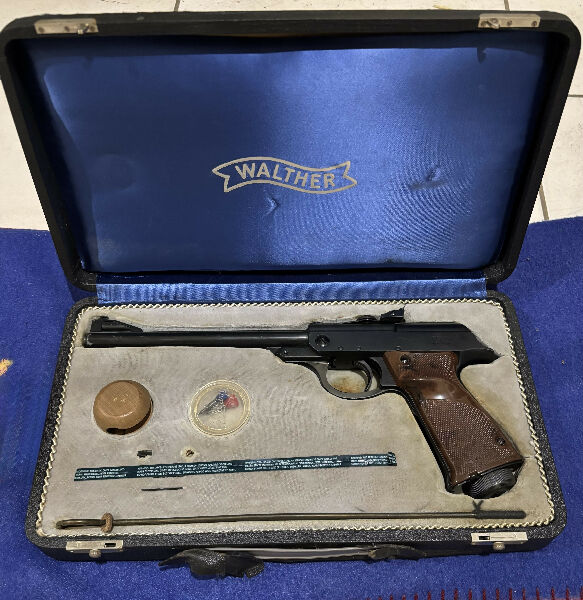 Walther LP53 air pistol. The same model used in 60s & 70s James Bond movie promo posters, this old single shot gun comes in its original box. Still shoots reall