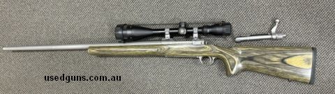 RUGER M77 Bolt Action Heavy Stainless Barrell chambered in .223 Remington - UNFIRED and as new. Magazine capacity 5 , Stock is Laminated and the attached Scope 