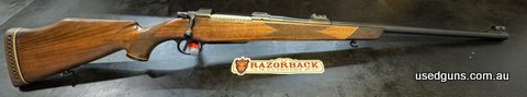Brno ZKK-602 lux. Firearm has been freshly cerakoted in midnight blue and re-oiled stock. Has express sights, set trigger and rosewood forend and jewelled extra