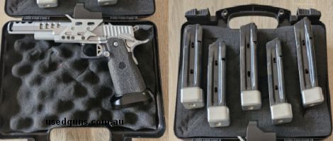 Excellent condition. Only shot minor loads. comes with 5 magazines
