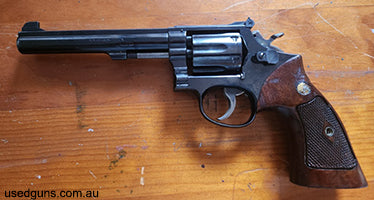 Model 14-2 in good condition. Some holster wear and usual marks from being used. LH grip panel has been sanded for better use with speed loaders (see photo). Bu