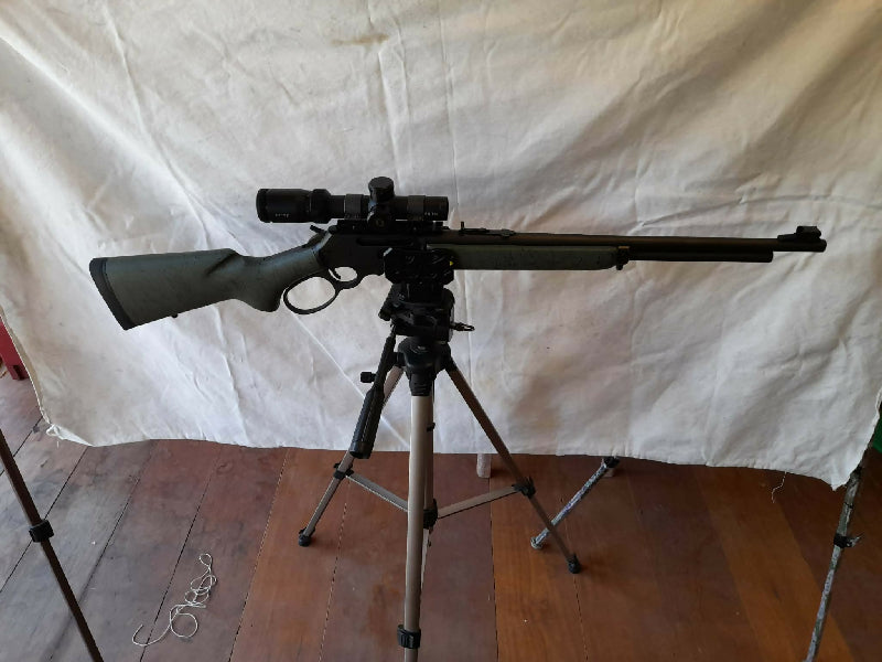Marlin 336 rifle in near new condition on shot roughly 50 rounds, comes with Bushnell 4500 elite scope, synthetic stock green in colour with black webbing and a