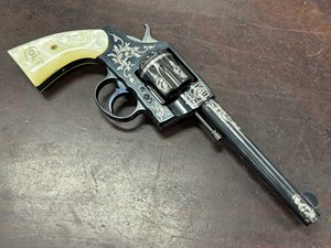 COLT
NEW ARMY & NAVY
41 LONG COLT
6 SHOT
6" BARREL
VGC BORE
TIGHT, SMOOTH CRISP ACTION
DEEP GLOSS BLUED FINISH
ENGRAVED WITH SILVER INLAY
PEARL GRIPS WITH CARVINGS ON BOTH SIDES
CLEAR COLT ADDRESS ON TOP OF BARREL
MANUFACTURED 1903
#220761

EXC+ $1990