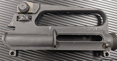 new stripped upper. Was off a 9mm, unfired, handling marks only but is over 20 years old so it's not perfect. Has gas port drilling to suit 5.56 or 300blk. No A