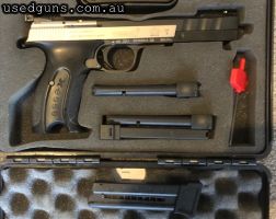 Pistol is in excellent condition unmarked with 4 x 10 shot mags ( 3 unused ). 3 dot rear adjustable sights .
