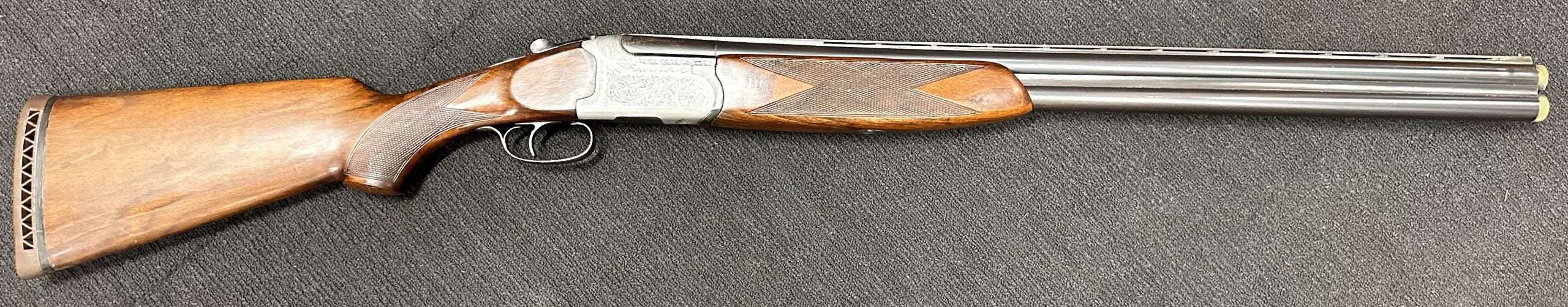 #213 Ejector only works on one side. Other is just an extractor. Shoots very well, with screw in chokes, no spares. I list all my guns as Fair unless they are n