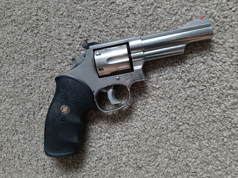 Smith Wesson Model 66-4 stainless steel with 4 inch barrel. Used for Service Match, trigger job and Hogue-grip. Excellent shooter, won't disappoint. Regretful s