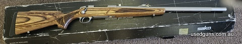 As new Sako 85 with stainless fluted barrel laminated stock with wide forend. No marks barreland bolt face also like new only fired 300 factory rounds clearing 
