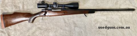 Winchester m70 in 300wm, heavy barrel with mostly nice deep bluing, new butt pad.