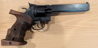 Smith & Wesson Model 14-3 modified for ISSF centrefire matches. Has slab barrel, large RH Nill target grip. Beautiful to shoot with, i'm just not continuing wit