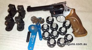 6 Inch Apex target barrel , bobbed hammer and worked action , trigger stop screw , crane lock , KN Master series grips, Cut for moon clips by SW Armorer at Gryc