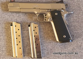 1911 Kimber Stainless model 2 with fibre optic front sight, upgraded trigger, g10 grips, extended mag release button, mag well plus 2 mags Handgun shoots really