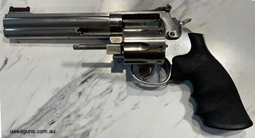 Competition Ready S&W 686-5, 6 inch stainless revolver in 7 shot 357 Magnum. This has been a backup gun to my 8 shot Smith and seen light use. Used with 38 spec