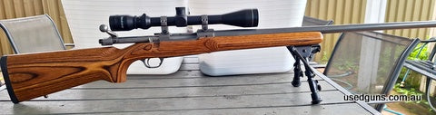 M77 heavy barrel varmint Shoots very accurate with wooden stock