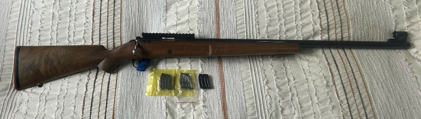 Winchester Model 52B target repeater. 1948 build date. Original barrel and action in a benchrest stock I believe was built by Geoff Slee. 3 x 5 shot magazines i