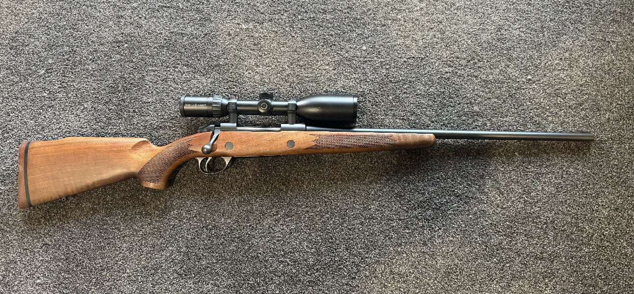 Sako model 85 timber in 25-06 with Schmidt & Bender 3x12-50 scope.