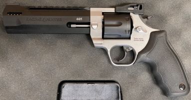 Taurus Raging Hunter, 44 Mag, double action revolver. Factory magna ported, factory rubber grip. Double lock-up. Striking silver and black finish. Rarely by pre