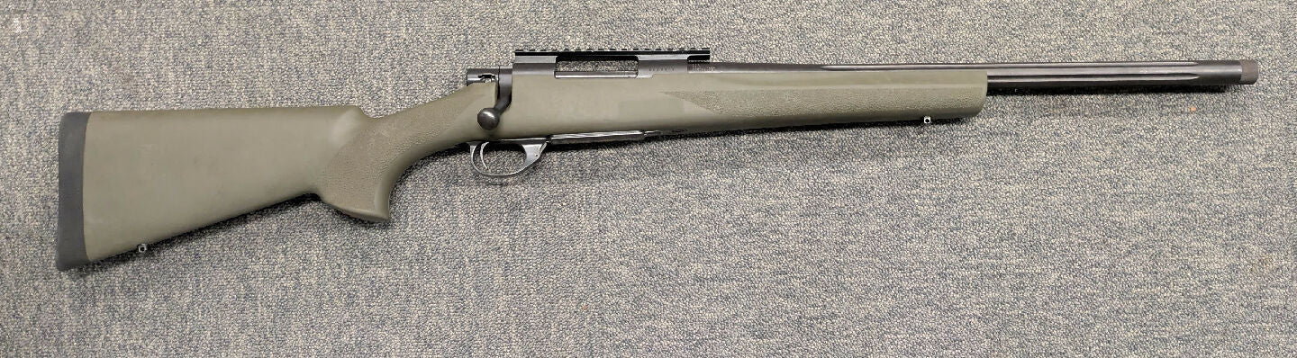 A Howa 1500 in 308 Win in very good condition. This rifle has a 20" fluted heavy barrel and is fitted Hogue green synthetic stock and a Picatinny rail. This rif
