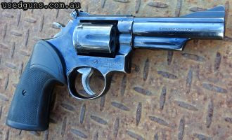 The S&W Combat Magnum Model 19, made famous in the Lethal Weapon movies. Some holster wear & storage marks. Mechanically fine. $25 Express Dealer delivery avail