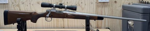 Remmington 700 with 24‚Äö√Ñ√∂‚àö√ë‚àöœÄstainless fluted barrel, Redfield 2-7 x32 scope. In very good condition other than the usual light handling marks on stoc